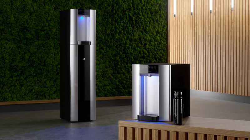 A Borg & Overström B6 floor standing water dispenser standing next to its countertop variant