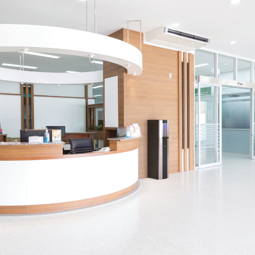A hospital reception area featuring a Borg & Overström floorstanding E6. 