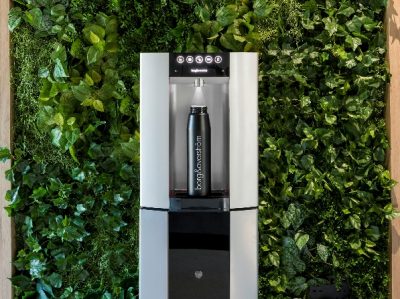 Borg & Overstrom E6 water dispenser with water bottle on living wall background